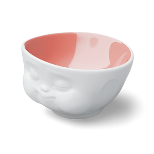 Designer 16.9 ounce capacity porcelain bowl in white with peach color on the inside featuring a sculpted ‘munching’ facial expression. From the TASSEN product family of fun dishware by FIFTYEIGHT Products. Quality bowl perfect for cereal, soup, side salads, and hearty dips.