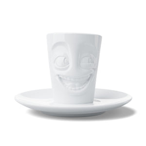 Espresso mug with a 'joking' facial expression and 2.7 oz capacity will start your day on a high note. Premium porcelain espresso cup in a tall 'mug' design with saucer in white. From the TASSEN product family of fun dishware by FIFTYEIGHT Products.