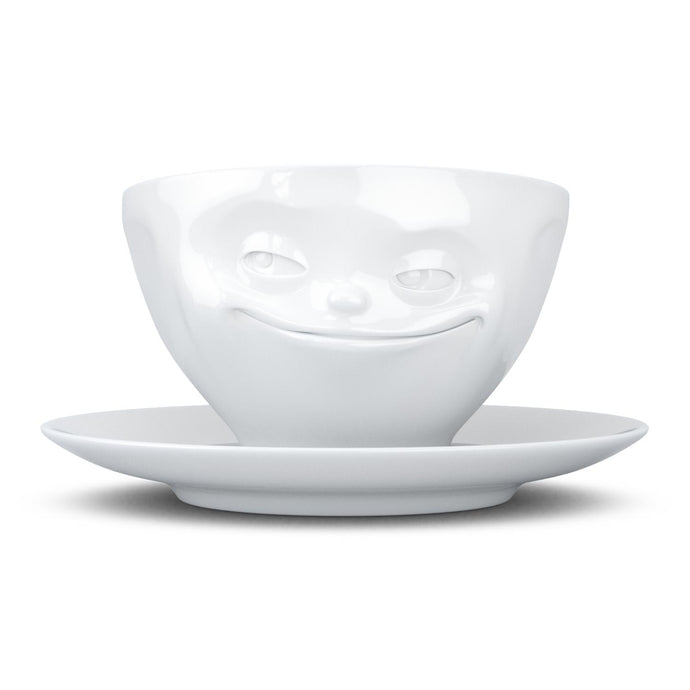 Coffee cup with a 'grinning' facial expression and 6.5 oz capacity. From the TASSEN product family of fun dishware by FIFTYEIGHT Products. Coffee cup with matching saucer crafted from quality porcelain.