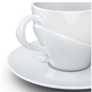 Premium porcelain coffee cup with saucer in white with sculpted Wolfgang Amadeus Mozart face. Dishwasher and microwave safe cup at 8.7 oz capacity. From the TALENT product family of cups dedicated to creative geniuses by FIFTYEIGHT Products.